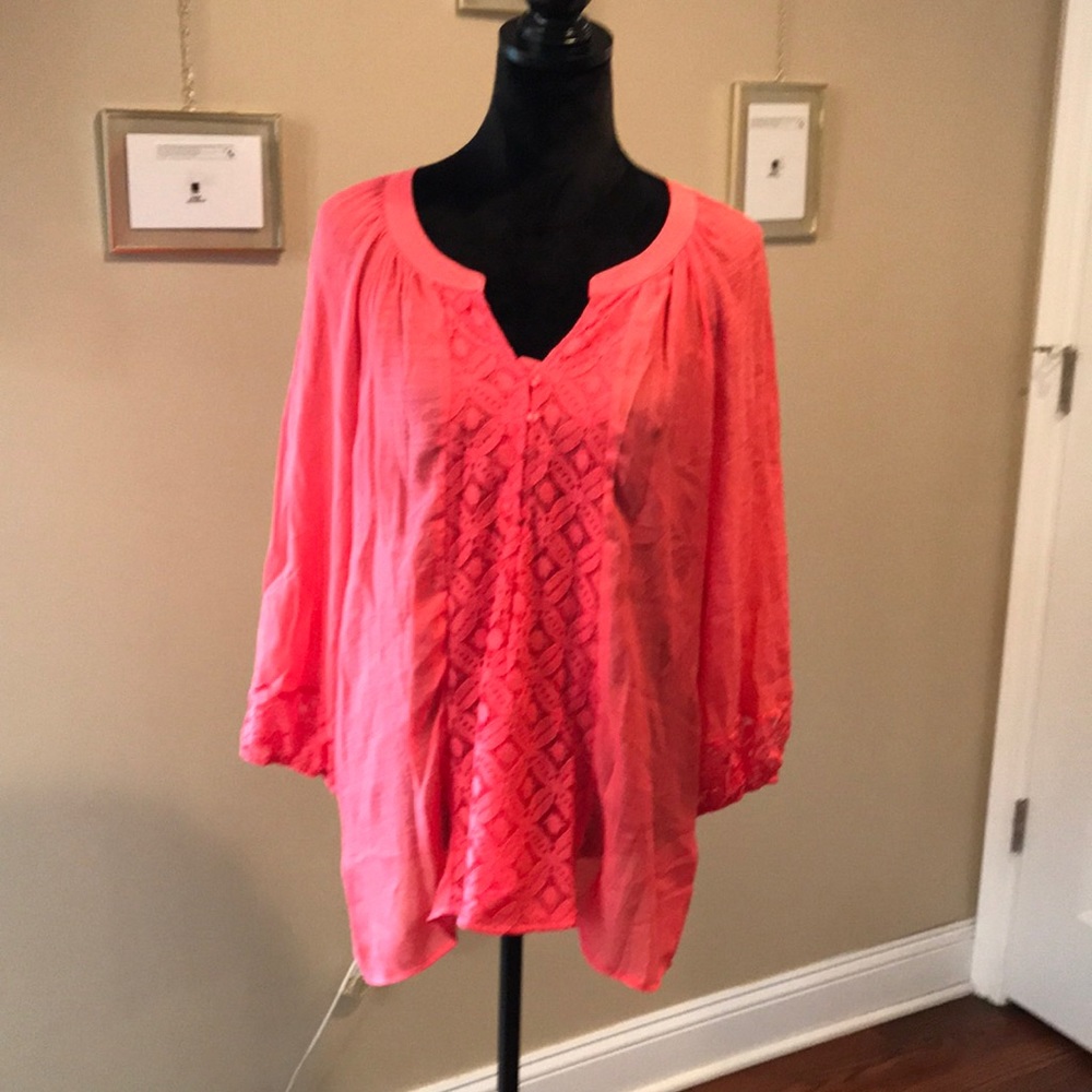 Fundamentals things, Coral colored shirt. The size is XLarge.